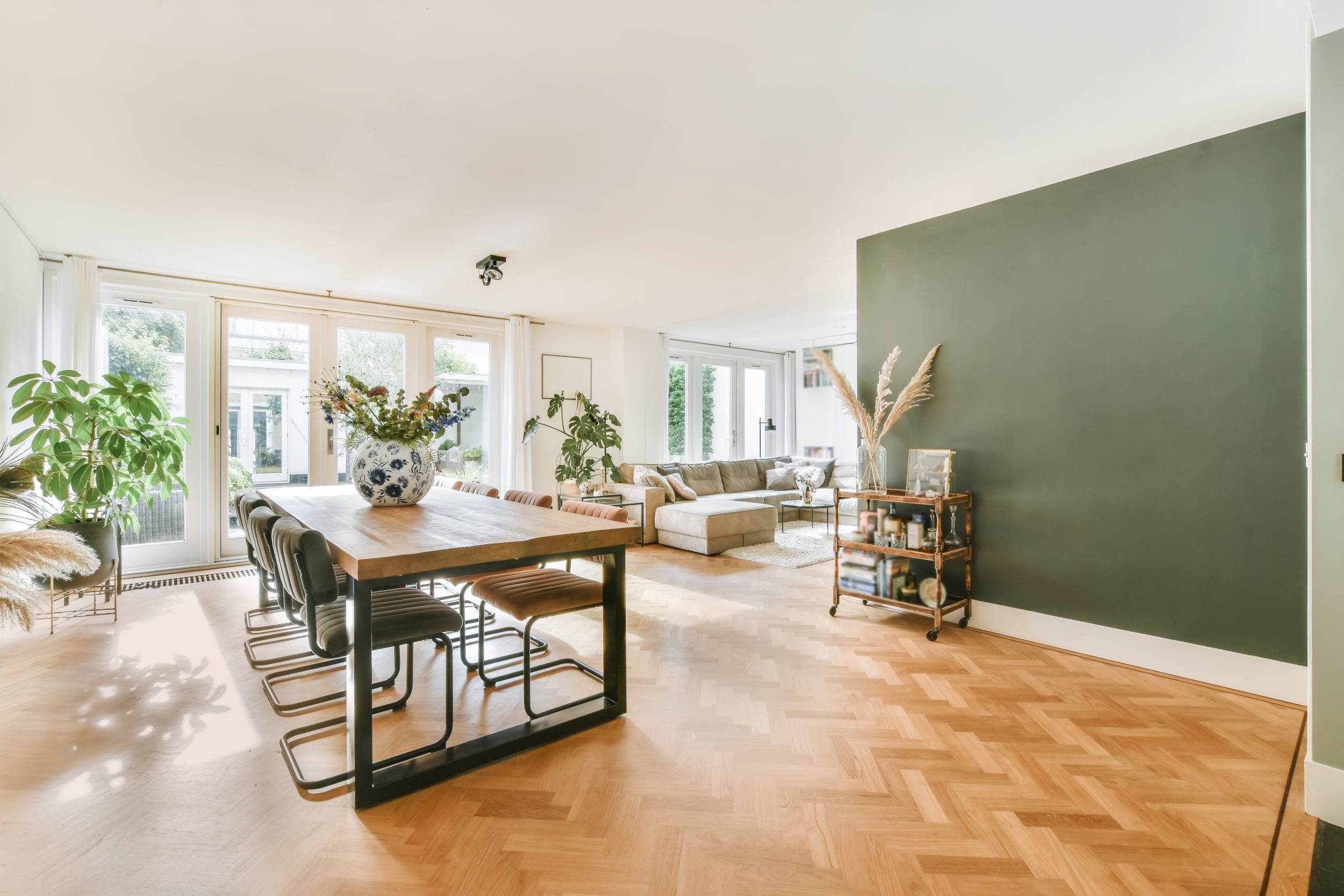 Stylish living room with a large comfortable sofa combined with a dining room